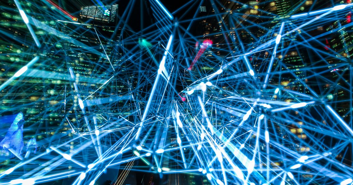 Glowing lines forming a dense network over a dark background